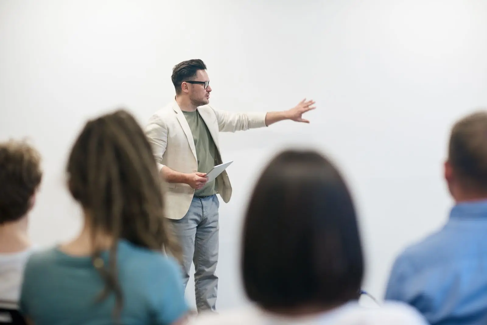 Designer presenting a prototype to a small team